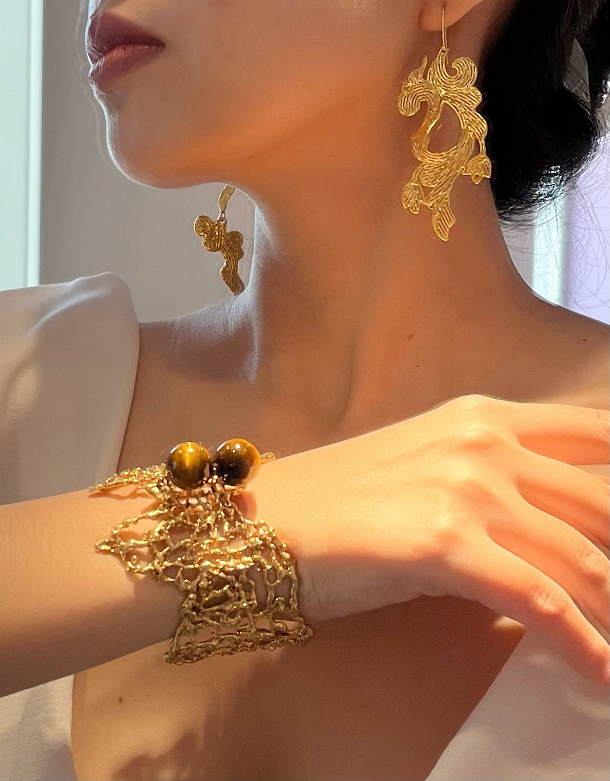 NAM PHƯƠNG brass asymmetrical earrings